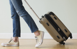 Traveler pulling suitcase